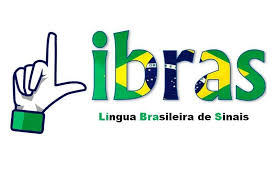 Imagem da palavra Libras desenhada. A letra L é formada pelos dedos indicador e polegar de uma mão, e as demais letras tem cores da Bandeira Brasileira. Abaixo está escrito, e letras pretas e verdes: Língua Brasileira de Sinais
