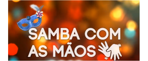 em fundo colorido, onde estão destacados do lado esquerdo uma máscara de carnaval e do lado direito o símbolo da tradução em libras, lê-se a frase Samba com As Mãos.